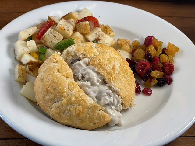 Individually wrapped sausage gravy stuffed biscuit with sheep herder potatoes (diced potatoes, bell peppers, and onions), and a mixed dried fruit package.